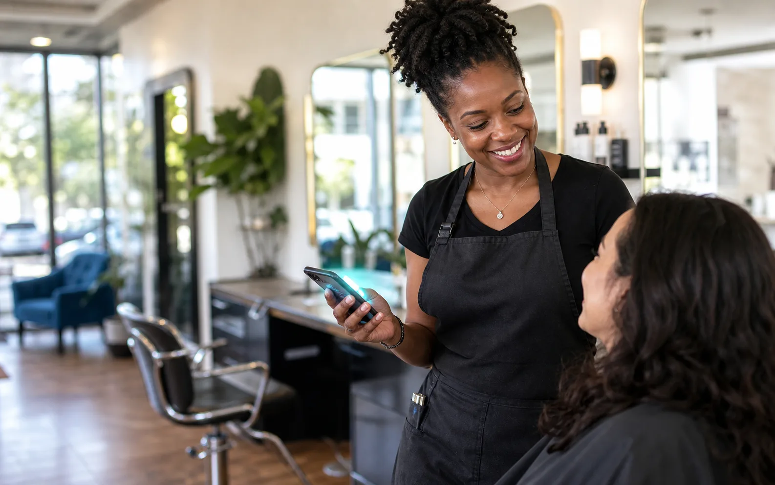 Salon owner speaking with a customer